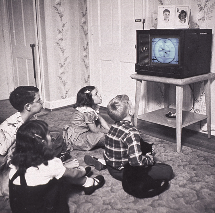 Children watching retro TV